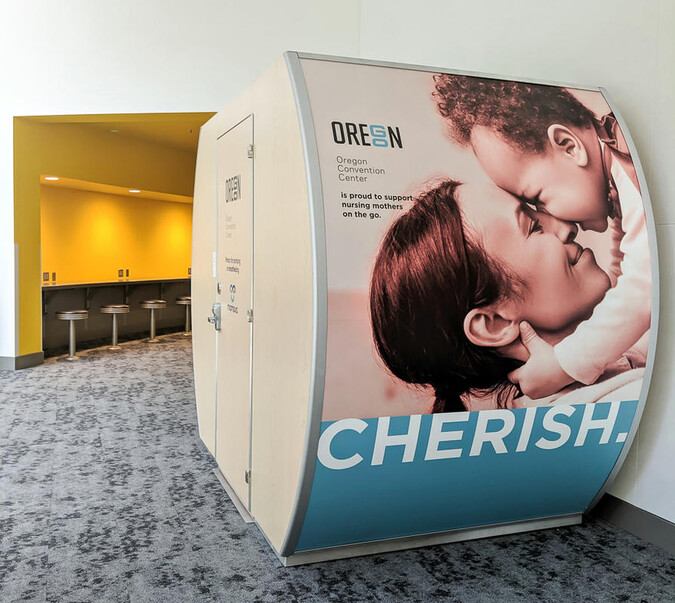 A Mamava wellness suite near a quiet seating space.  