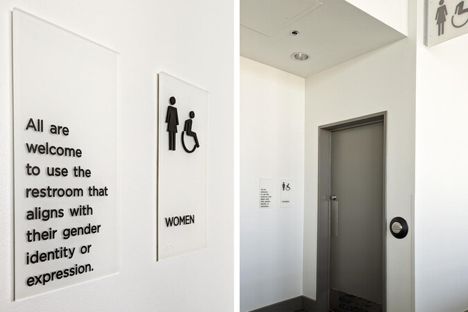 An inclusive restroom sign on a wall. 