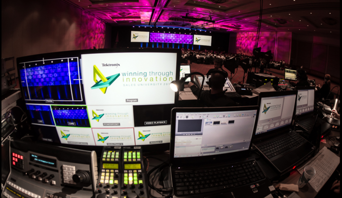 Audiovisual control station with various screens displays.