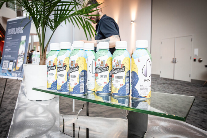 PATH reusable water bottles on a table.