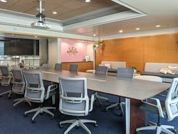 Modern conference room with a long table.