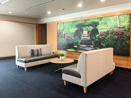 Modern seating area with gray sofas.