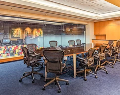 Spacious conference room with a long table.